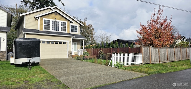 view of front facade featuring a front yard and a garage