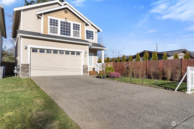 view of front facade featuring a garage and a front lawn