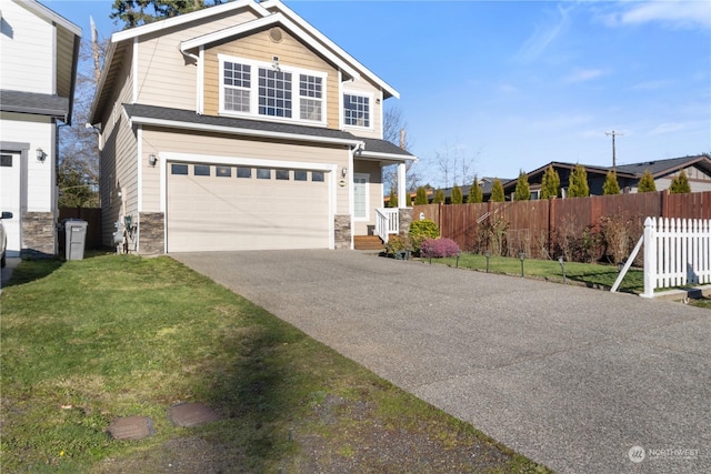 view of front of property featuring a garage and a front lawn