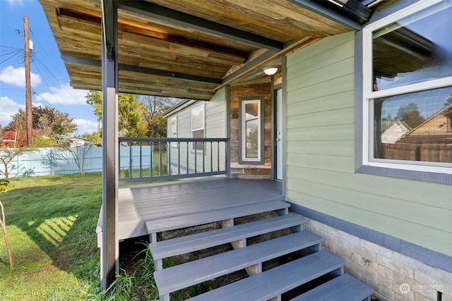 wooden deck with a yard