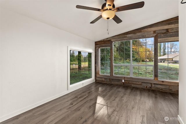 unfurnished sunroom with ceiling fan and vaulted ceiling