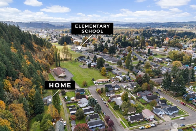 drone / aerial view featuring a mountain view