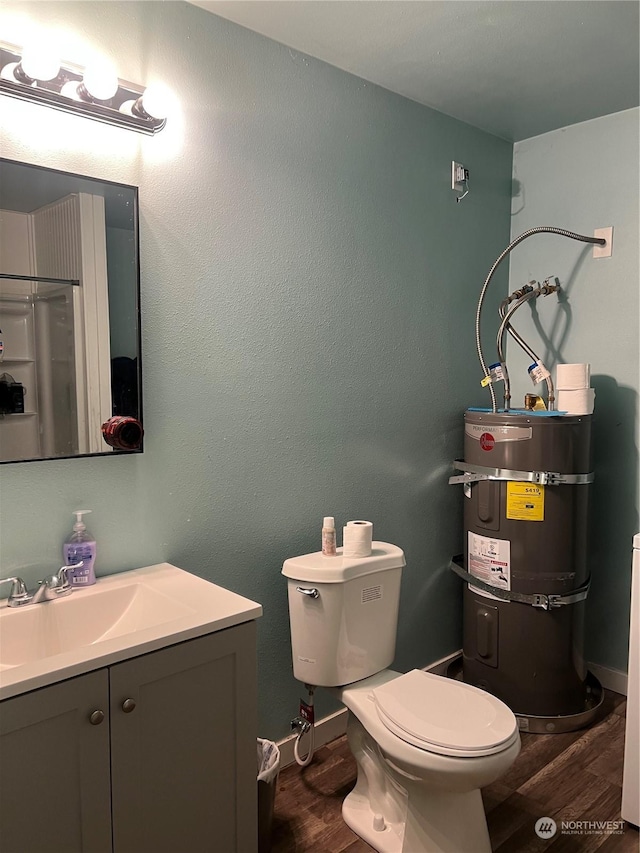 bathroom with secured water heater, vanity, a shower, toilet, and wood-type flooring