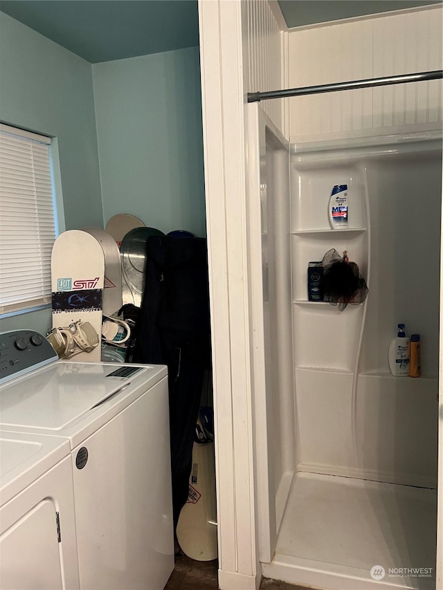 laundry area with hardwood / wood-style floors and washing machine and dryer