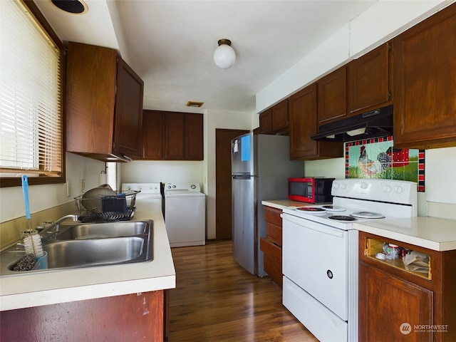 kitchen featuring separate washer and dryer, stainless steel refrigerator, dark hardwood / wood-style floors, white electric stove, and sink