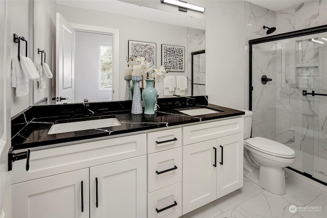 bathroom featuring walk in shower, vanity, and toilet