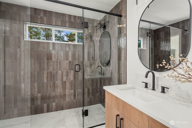 bathroom with vanity and walk in shower