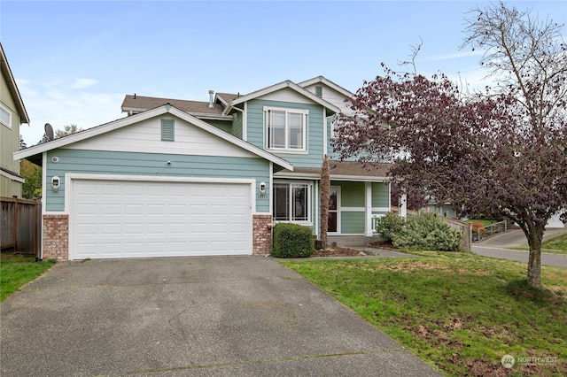 craftsman-style house featuring a front lawn and a garage