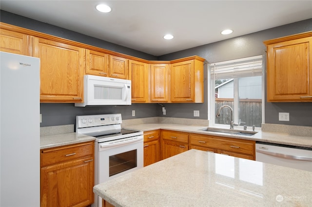 kitchen with sink and white appliances