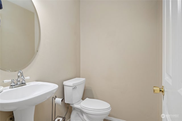 bathroom featuring sink and toilet