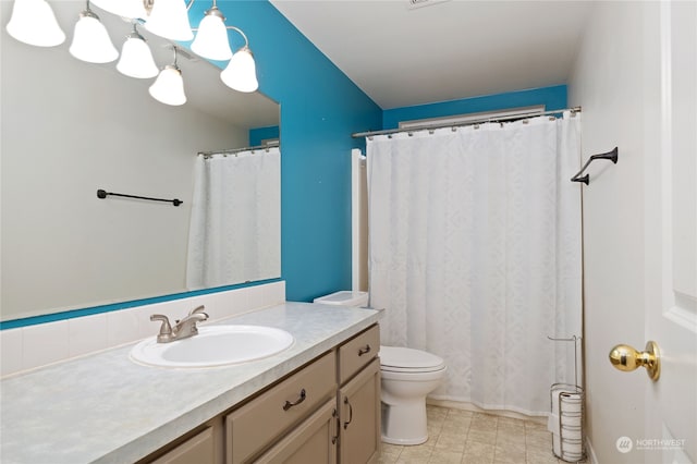 bathroom with vanity, a shower with curtain, and toilet