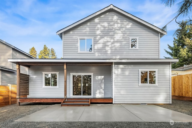 rear view of property featuring a patio area