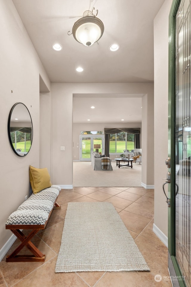 entryway featuring light tile patterned flooring