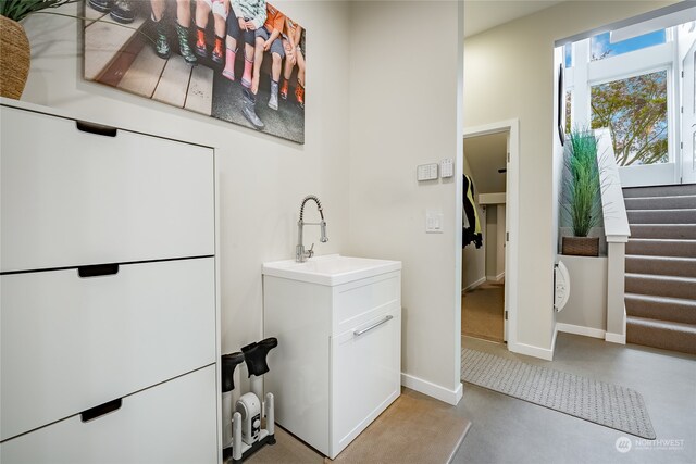 bathroom featuring vanity and concrete floors