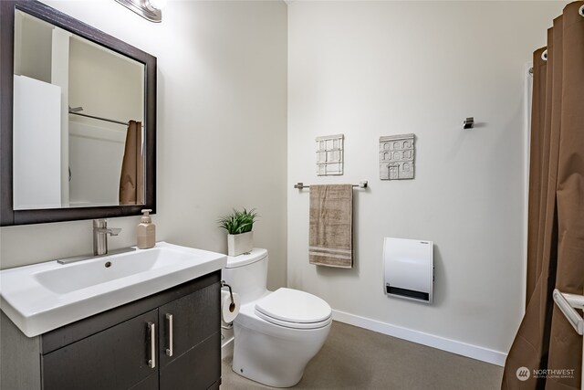 bathroom with toilet and vanity