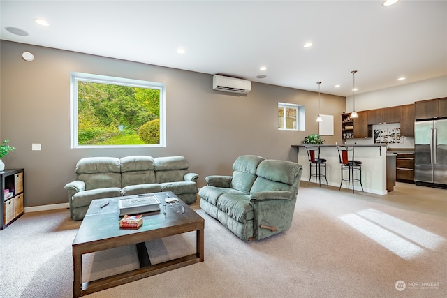 carpeted living room featuring a wall unit AC