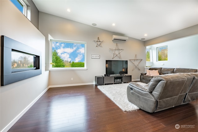 living room featuring a wall mounted AC and dark hardwood / wood-style flooring