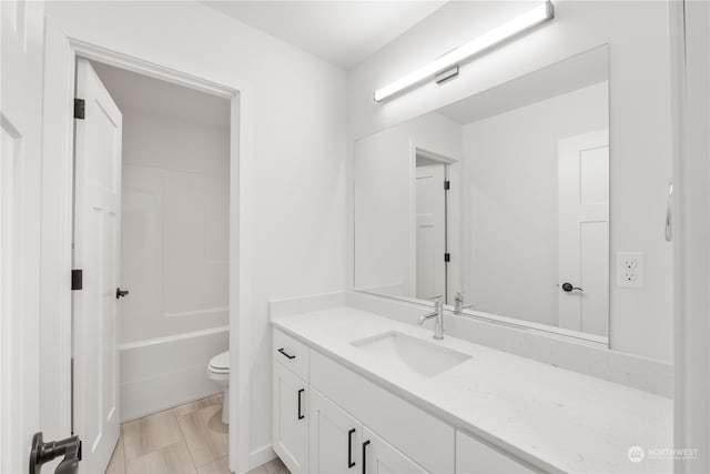 full bathroom with vanity, toilet, and shower / bath combination