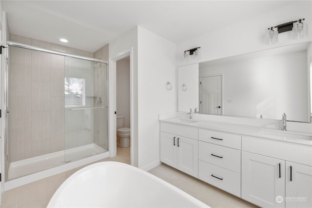 full bathroom with vanity, toilet, and separate shower and tub