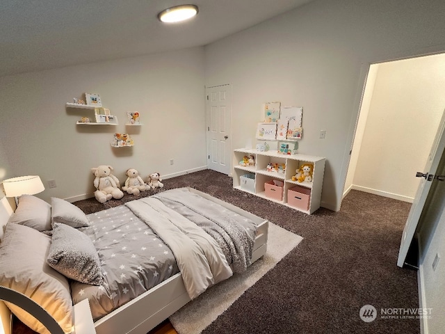 carpeted bedroom with lofted ceiling