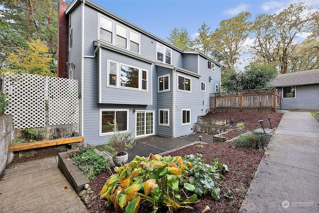 back of property with a patio area