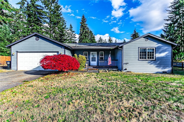 ranch-style home featuring a garage and a front yard