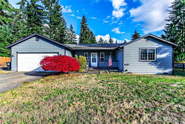604 Nieland Loop SE, Rainier, WA 98576 - ranch-style home with covered porch, asphalt driveway, a garage, and crawl space
