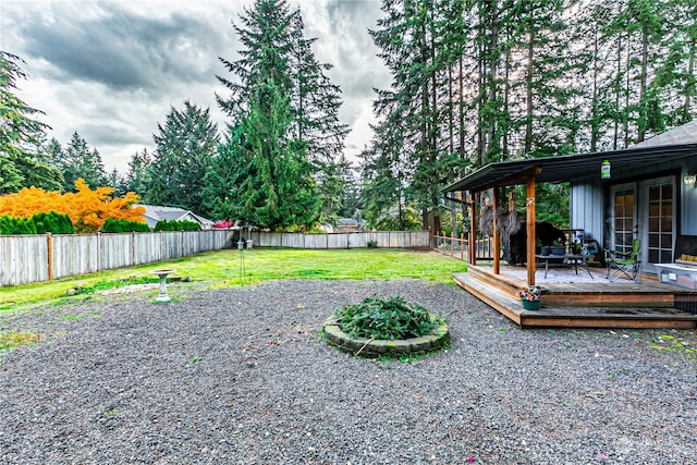 view of yard featuring a wooden deck