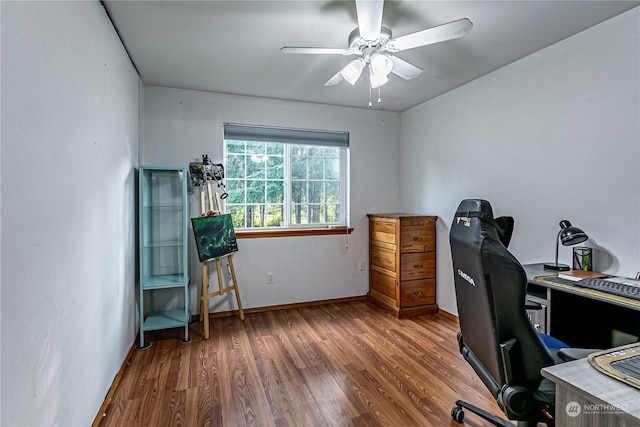 604 Nieland Loop SE, Rainier, WA 98576 - home office featuring wood finished floors, a ceiling fan, and baseboards