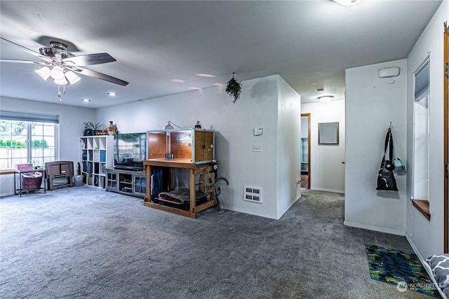 604 Nieland Loop SE, Rainier, WA 98576 - living area with carpet floors, a ceiling fan, and baseboards