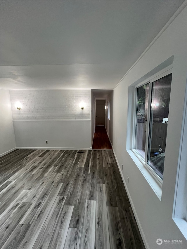 empty room with hardwood / wood-style floors