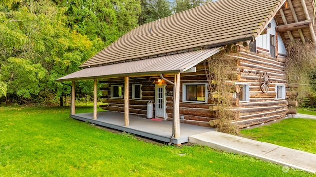 view of outdoor structure featuring a lawn