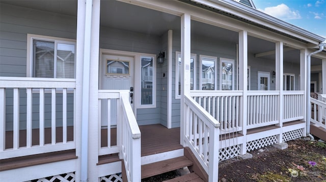 entrance to property featuring a porch