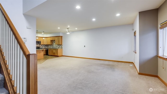 2733 Diamond St Unit D, Milton, WA 98354 - unfurnished living room featuring ceiling fan and light colored carpet