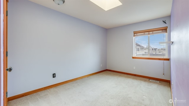 2733 Diamond St Unit D, Milton, WA 98354 - spare room with light carpet and a skylight