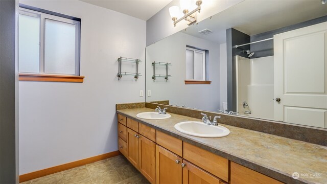 2733 Diamond St Unit D, Milton, WA 98354 - bathroom featuring vanity, toilet, walk in shower, and tile patterned flooring