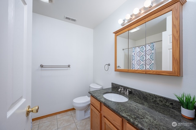 bathroom with vanity, toilet, a shower with curtain, and tile patterned flooring