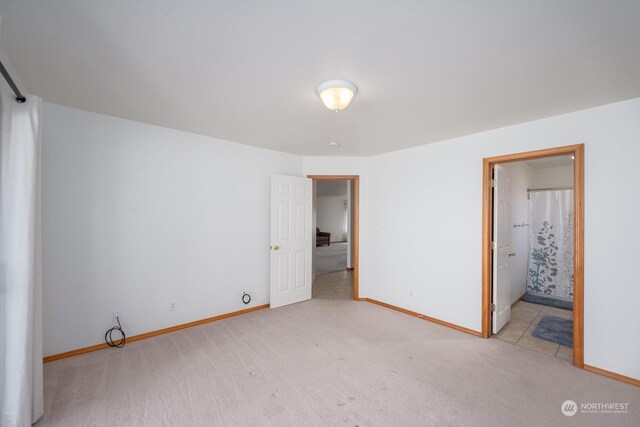 1300 W Marina Dr Unit 34, Moses Lake, WA 98837 - unfurnished bedroom with light colored carpet and baseboards