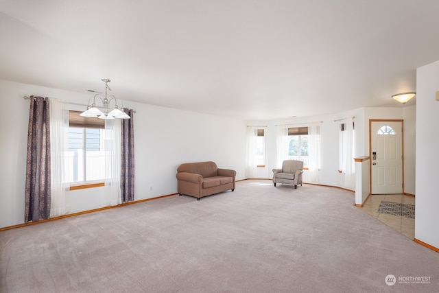 unfurnished room with a wealth of natural light and light carpet