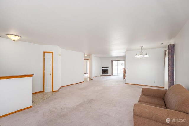 1300 W Marina Dr Unit 34, Moses Lake, WA 98837 - living area with light carpet, a chandelier, and baseboards