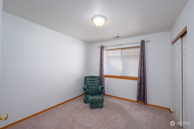 unfurnished room with light colored carpet