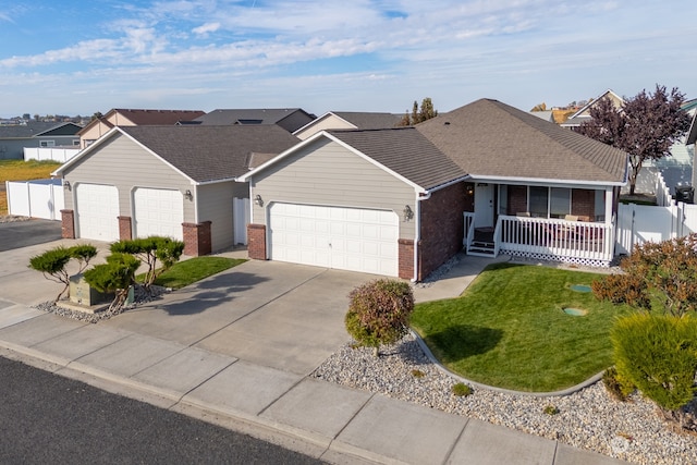 ranch-style house with a porch, a front yard, and a garage