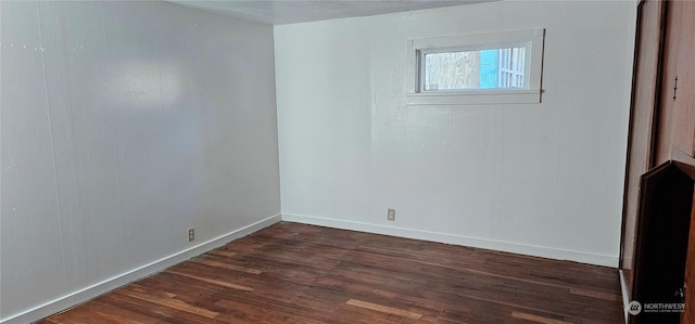 unfurnished room featuring dark hardwood / wood-style floors