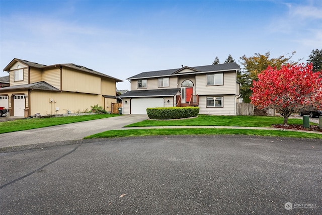 view of front facade with a front lawn and a garage