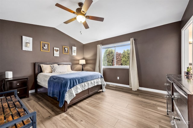 bedroom featuring lofted ceiling, wood-type flooring, and ceiling fan