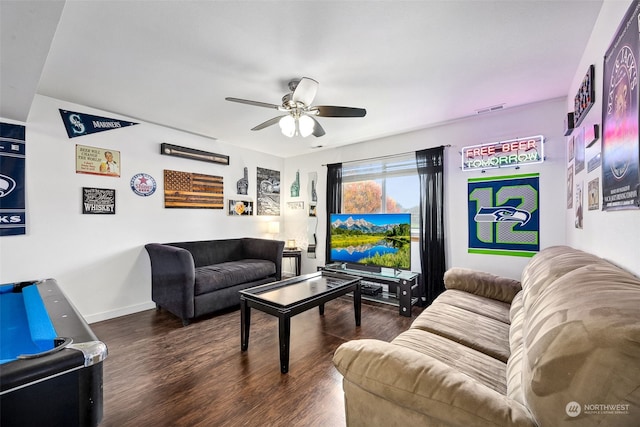 living room featuring dark hardwood / wood-style floors and ceiling fan