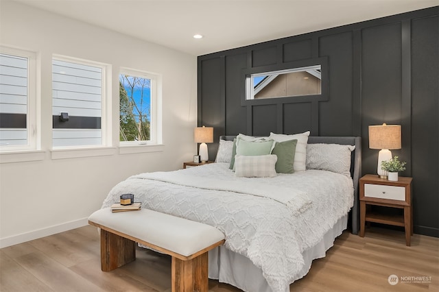 bedroom with light hardwood / wood-style flooring