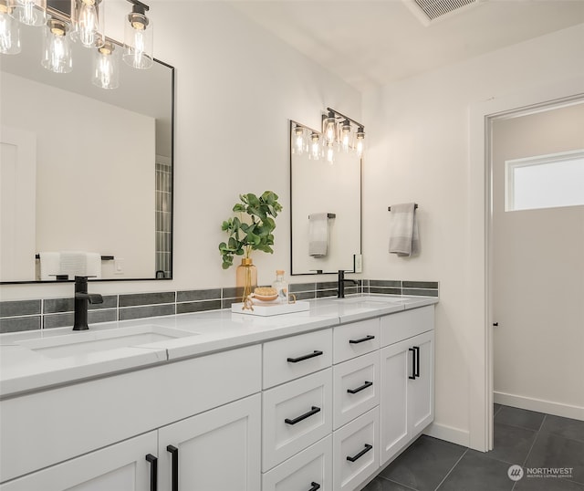 bathroom featuring tile patterned flooring and vanity