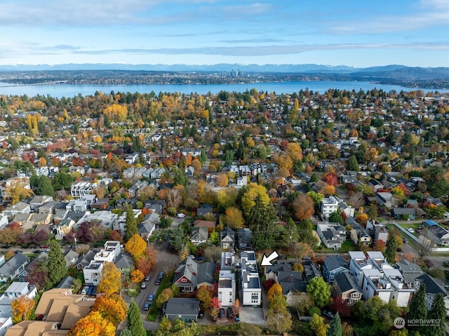 bird's eye view featuring a water and mountain view