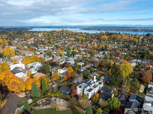 birds eye view of property with a water view